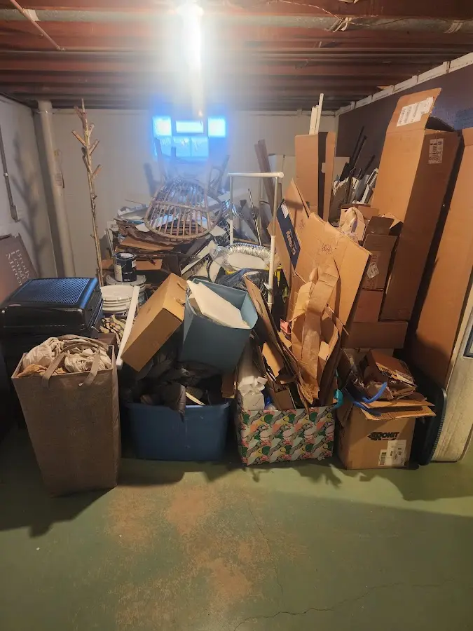 Roll-off dumpster container at job site for 2 Yard Dumpster Rental in Hazlehurst